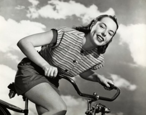Low angle view of a young woman cycling Poster Print - Item # VARSAL2552936