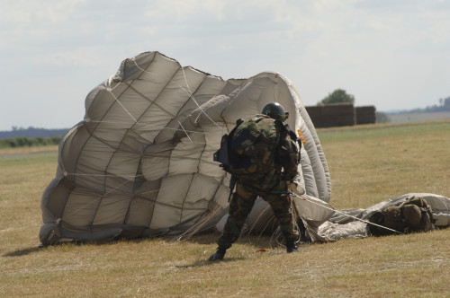 A member of the Pathfinder Platoon collapses his parachute after a HALO jump Poster Print - Item # VARPSTACH100015M