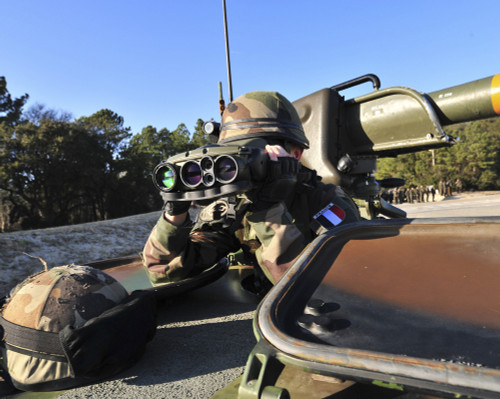 A soldier scans the horizon through a pair of binoculars Poster Print - Item # VARPSTSTK105256M