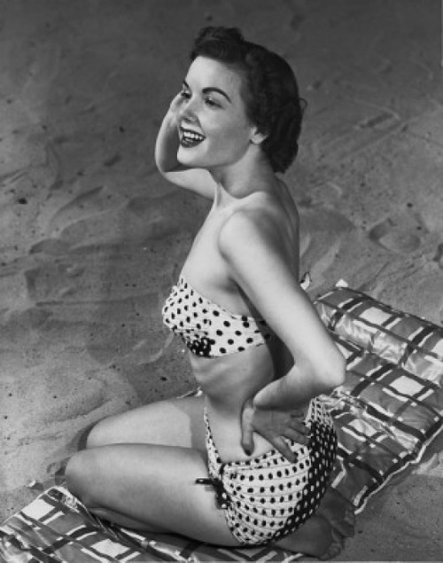 Side profile of a young woman posing on the beach Poster Print - Item # VARSAL25521161A Side profile of a young woman posing on the beach Poster Print - Item # VARSAL25521161A