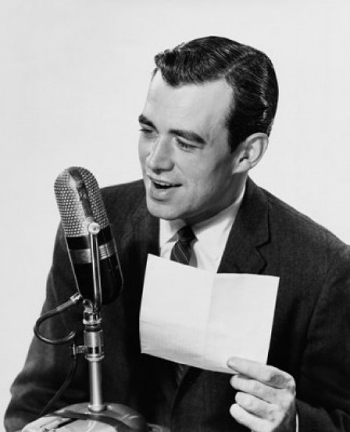 Mid adult man speaking into a microphone Poster Print - Item # VARSAL2553064A