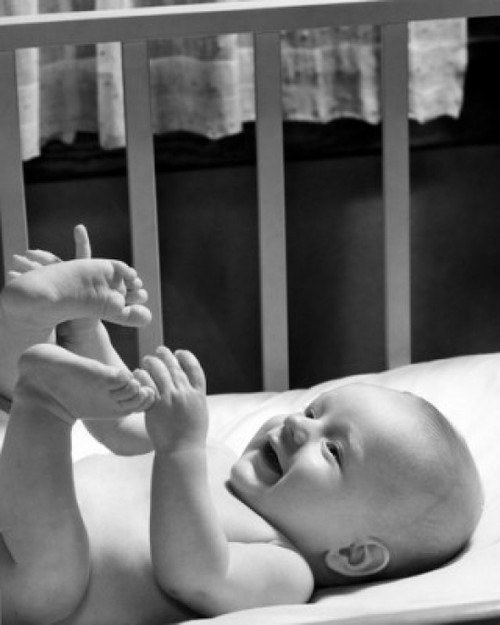 Portrait of cheerful baby with feet up Poster Print - Item # VARSAL2559619
