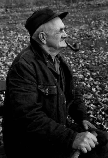 Senior man smoking pipe on bench Poster Print - Item # VARSAL2559959