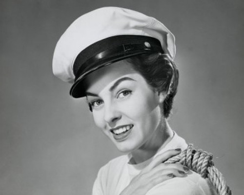 Portrait of a young woman wearing a sailor hat and smiling Poster Print - Item # VARSAL25527173