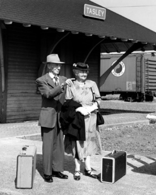 Senior couple waiting at railway station with luggage Poster Print - Item # VARSAL25548950