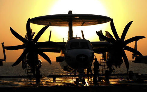 Sailors work on an E-2C Hawkeye aircraft aboard USS Abraham Lincoln Poster Print - Item # VARPSTSTK104020M