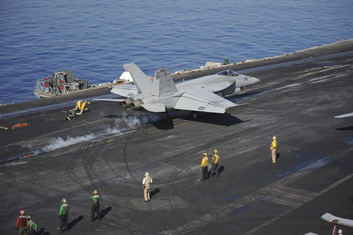 Mediterranean Sea, October 25, 2013 - An F/A-18E Super Hornet launches from the aircraft carrier USS Nimitz. Poster Print - Item # VARPSTSTK108070M