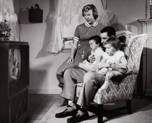 Parents with their two daughters watching television Poster Print - Item # VARSAL2551046