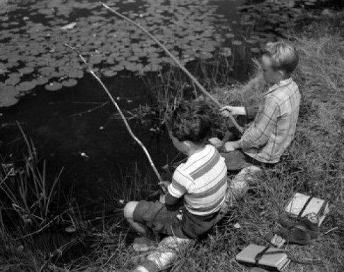 Two boys sitting and fishing with homemade fishing rod Poster Print - Item # VARSAL25516344
