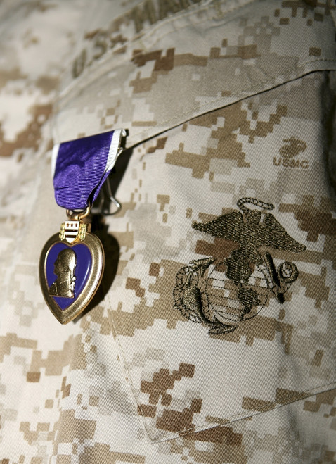 A soldier wears his Purple Heart on his digital camouflage minutes after being awarded the medal. Poster Print - Item # VARPSTSTK102510M