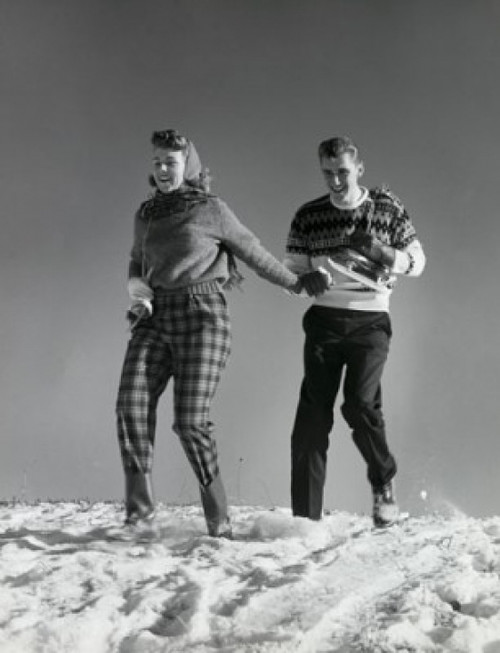 Low angle view of a young couple walking in snow Poster Print - Item # VARSAL25538833