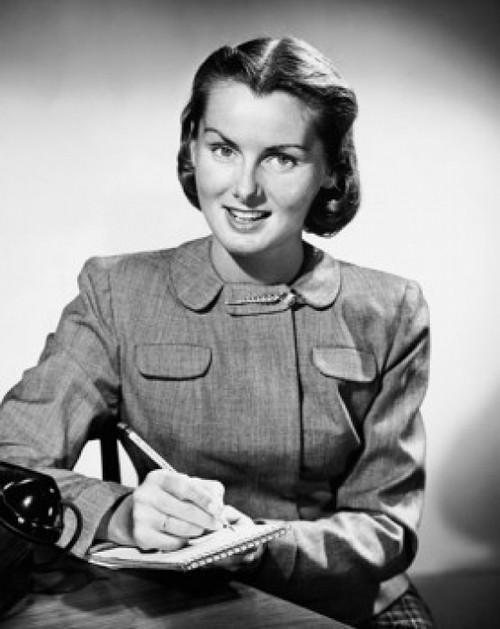 Portrait of a young woman writing on a notepad Poster Print - Item # VARSAL25523964