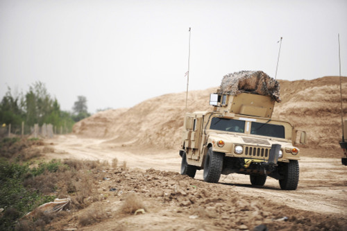 April 9, 2009 - A Humvee conducts security during a patrol in the Iraqi village of Bakr, in support of Operation Iraqi Freedom. Poster Print - Item # VARPSTSTK102914M