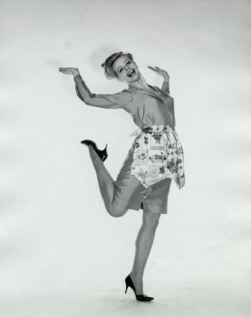 Portrait of a young woman standing on one leg Poster Print