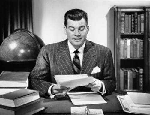 Businessman sitting in an office and reading documents Poster Print - Item # VARSAL2553065B