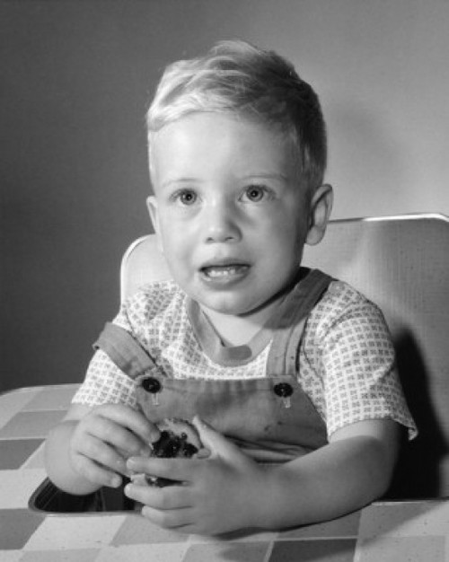 Little boy holding biscuit Poster Print - Item # VARSAL2559693