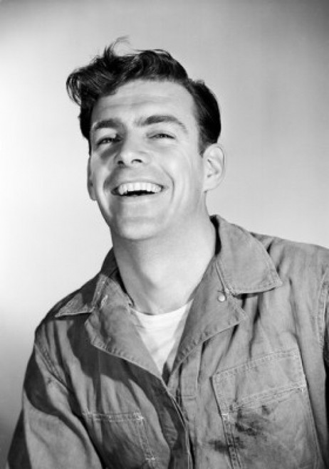 Studio portrait of mid adult man in coveralls Poster Print - Item # VARSAL255417502