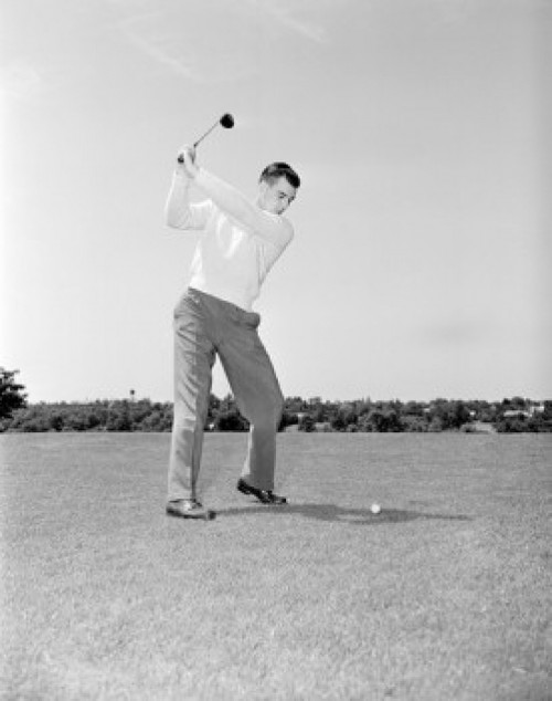Young man playing golf Poster Print - Item # VARSAL255419215