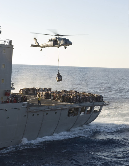 An MH-60S Sea Hawk helicopter carries supplies Poster Print - Item # VARPSTSTK106654M