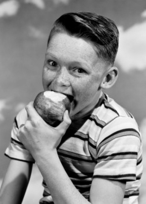 Portrait of boy eating apple Poster Print - Item # VARSAL255417493