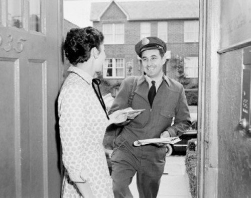 Woman receiving letter from postman Poster Print - Item # VARSAL255422427