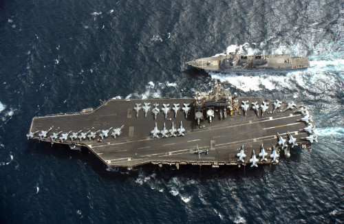 Persian Gulf, May 5, 2006 - The guided missile destroyer USS McCampbell comes alongside the Nimitz-class aircraft carrier USS Ronald Reagan for a routine fueling at sea. Poster Print - Item # VARPSTSTK101461M