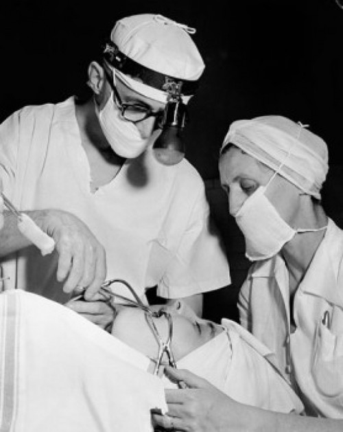 Patient getting treatment from two oral surgeons Poster Print - Item # VARSAL255104