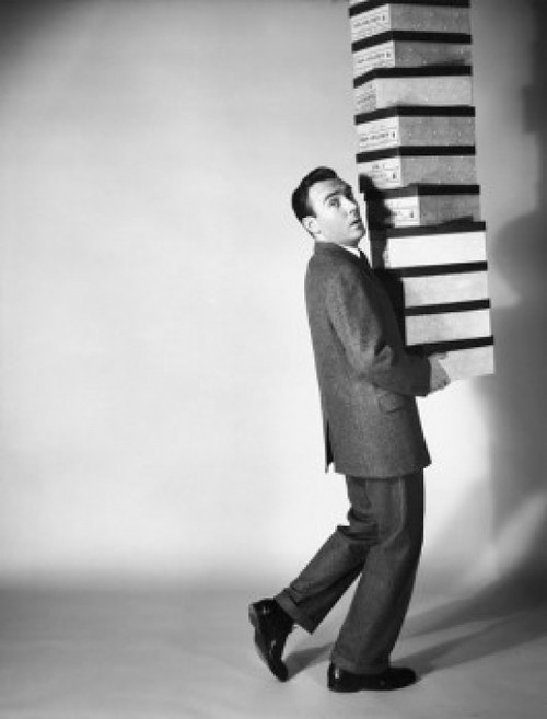 Portrait of a businessman carrying a stack of boxes Poster Print - Item # VARSAL25548189