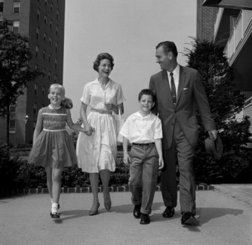 Boy and girl walking with parents outside flats Poster Print - Item # VARSAL255417160A