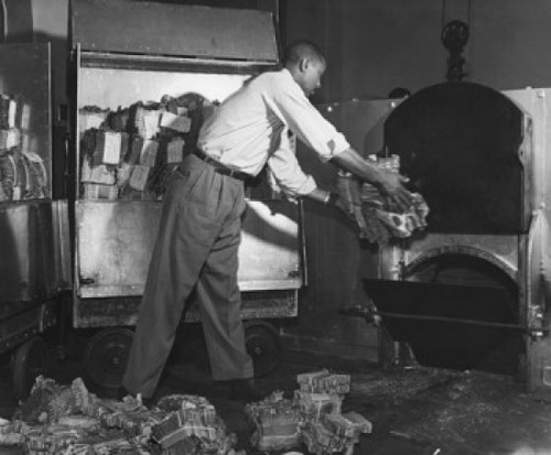 Man putting currency notes into a incinerator Poster Print - Item # VARSAL990118155