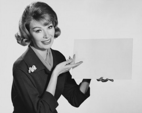 Portrait of a young woman holding a blank placard Poster Print - Item # VARSAL25541938