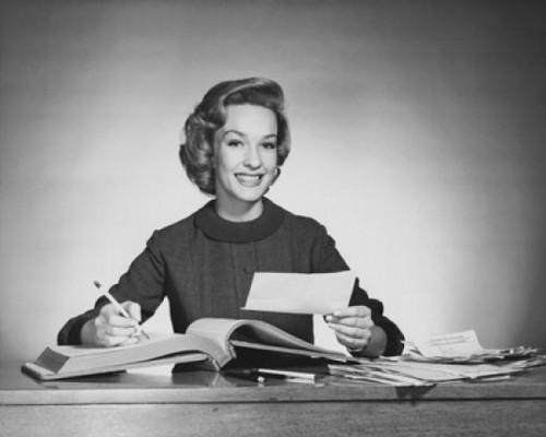 Portrait of a businesswoman writing in an accounting ledger Poster Print - Item # VARSAL255518