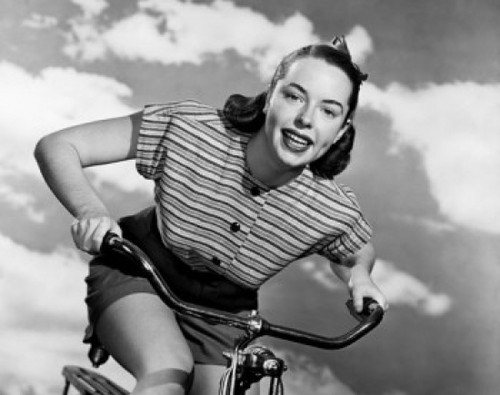 Low angle view of young woman cycling Poster Print - Item # VARSAL2556050