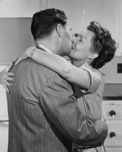 Mid adult couple kissing Poster Print - Item # VARSAL25550165