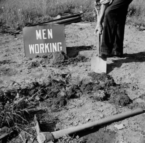 Low section of man digging ground Poster Print