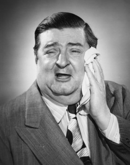 Studio portrait of mature man suffering from toothache Poster Print - Item # VARSAL25534849