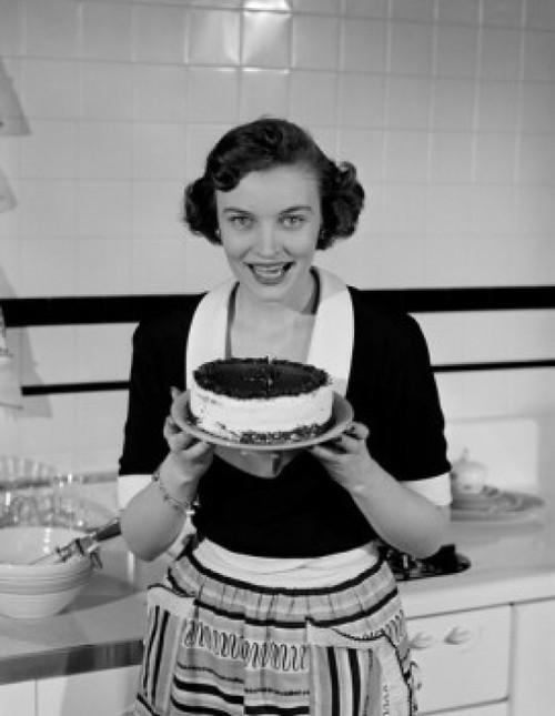 Happy young woman holding layer cake Poster Print - Item # VARSAL255423278