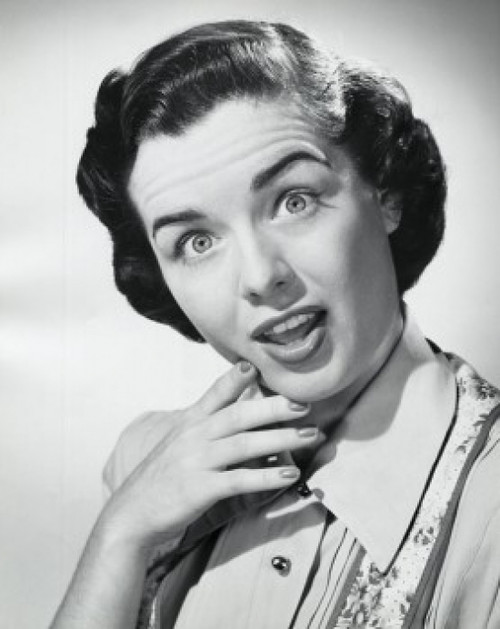 Studio portrait of young woman looking surprised Poster Print - Item # VARSAL25510480