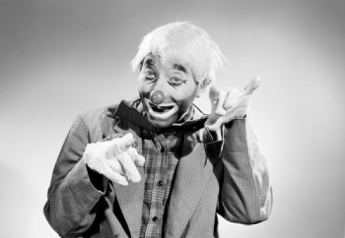 Studio portrait of clown Poster Print