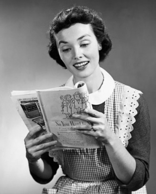 Studio shot of young woman reading magazine Poster Print - Item # VARSAL25528928