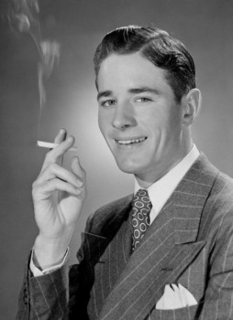 Portrait of mid adult man smoking cigarette Poster Print - Item # VARSAL255418880