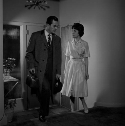 Couple talking in entrance hall Poster Print - Item # VARSAL255422683