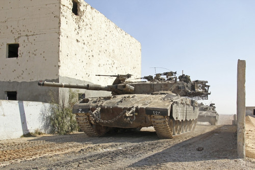 An Israel Defense Force Merkava Mark II main battle tank demonstrates urban warfare techniques Poster Print - Item # VARPSTZDN100137M