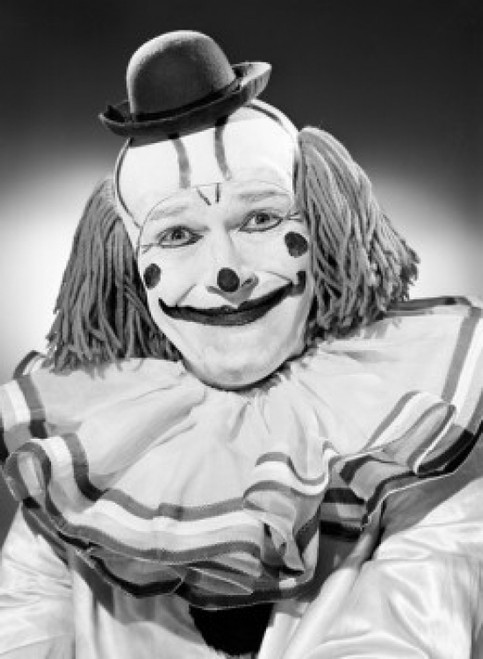 Studio portrait of clown smiling Poster Print