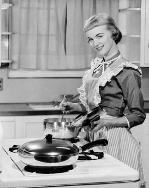 Young woman cooking in kitchen and smiling Poster Print - Item # VARSAL25515196B