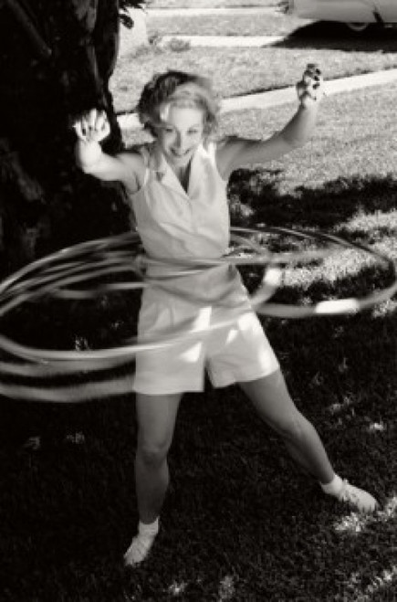 Young woman spinning hula hoops Poster Print - Item # VARSAL1073101