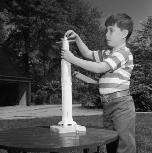 Boy playing with toy rocket Poster Print - Item # VARSAL255420963