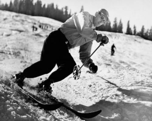 Mid adult man skiing downhill Poster Print
