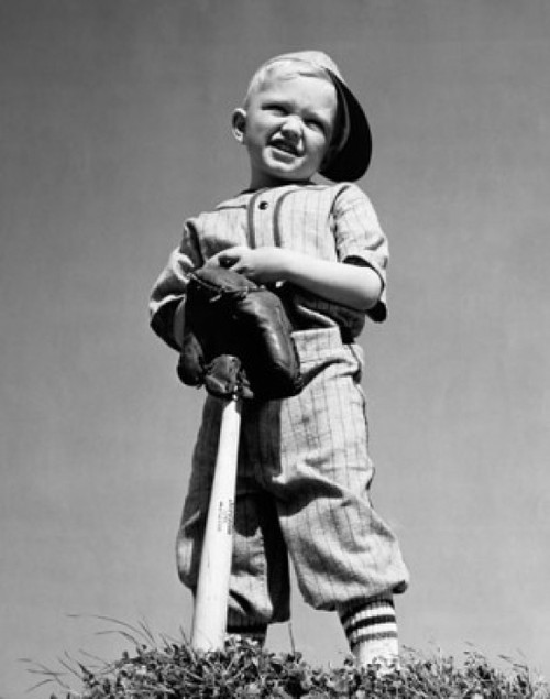 Low angle view of a boy holding a baseball bat and squinting Poster Print - Item # VARSAL25520405B