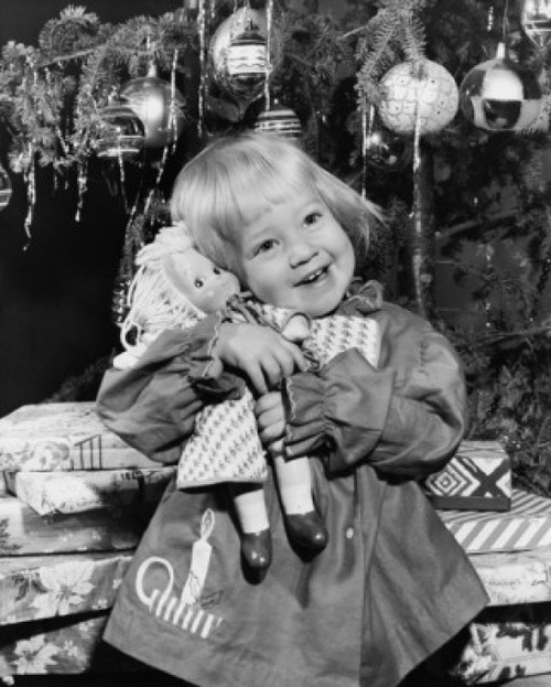 Close-up of a girl standing in front of Christmas presents and hugging a doll Poster Print - Item # VARSAL25522173 Close-up of a girl standing in front of Christmas presents and hugging a doll Poster Print - Item # VARSAL25522173